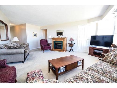 1001-7 Gale Crescent, St. Catharines, ON - Indoor Photo Showing Living Room With Fireplace