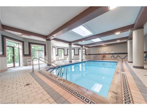 320-8111 Forest Glen Drive, Niagara Falls, ON - Indoor Photo Showing Other Room With In Ground Pool