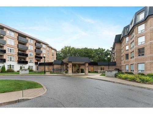 320-8111 Forest Glen Drive, Niagara Falls, ON - Outdoor With Balcony With Facade