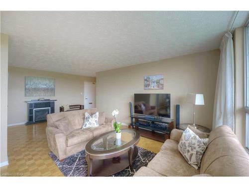 804-35 Towering Heights Boulevard, St. Catharines, ON - Indoor Photo Showing Living Room With Fireplace