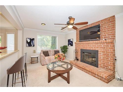 24 Bascary Crescent, St. Catharines, ON - Indoor Photo Showing Living Room With Fireplace