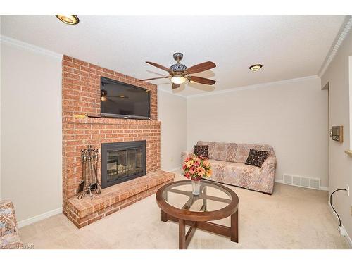 24 Bascary Crescent, St. Catharines, ON - Indoor Photo Showing Living Room With Fireplace