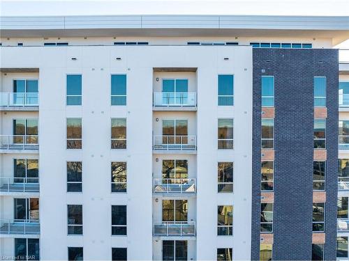 703-118 West Street, Port Colborne, ON - Outdoor With Balcony With Facade