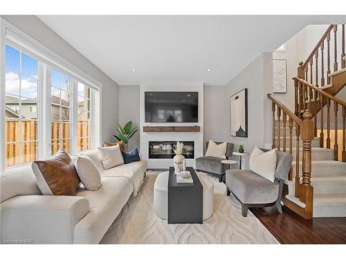 1-77 Avery Crescent, St. Catharines, ON - Indoor Photo Showing Living Room With Fireplace