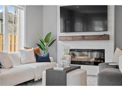 1-77 Avery Crescent, St. Catharines, ON - Indoor Photo Showing Living Room With Fireplace