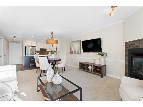 205-70 Main Street, St. Catharines, ON - Indoor Photo Showing Living Room With Fireplace