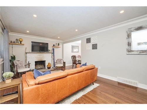 12 Corbett Avenue, St. Catharines, ON - Indoor Photo Showing Living Room With Fireplace