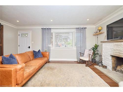 12 Corbett Avenue, St. Catharines, ON - Indoor Photo Showing Living Room With Fireplace