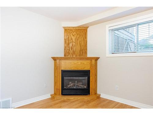 65 Arbour Glen Drive, St. Catharines, ON - Indoor Photo Showing Living Room With Fireplace