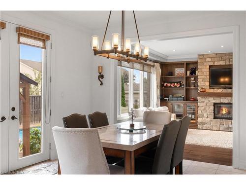 8829 Joseph Court, Niagara Falls, ON - Indoor Photo Showing Dining Room With Fireplace