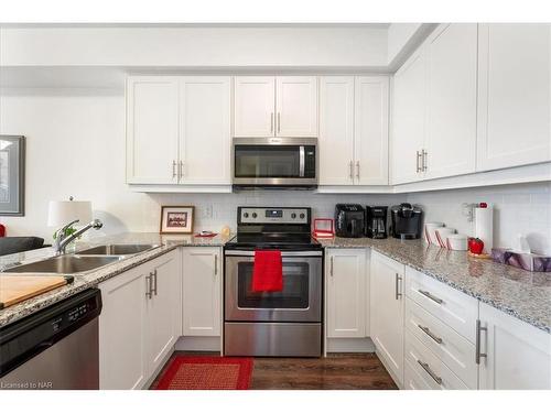 225-8111 Forest Glen Drive, Niagara Falls, ON - Indoor Photo Showing Kitchen With Double Sink