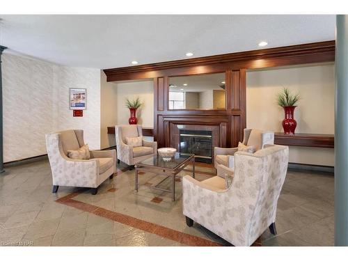 225-8111 Forest Glen Drive, Niagara Falls, ON - Indoor Photo Showing Living Room With Fireplace