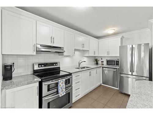 142-1058 Falgarwood Drive, Oakville, ON - Indoor Photo Showing Kitchen With Stainless Steel Kitchen With Double Sink