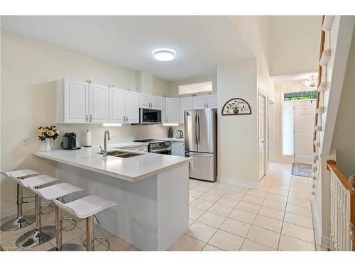 13-8142 Costabile Drive, Niagara Falls, ON - Indoor Photo Showing Kitchen With Double Sink