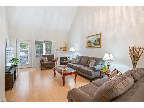 13-8142 Costabile Drive, Niagara Falls, ON - Indoor Photo Showing Living Room With Fireplace