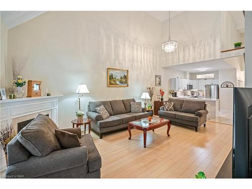 13-8142 Costabile Drive, Niagara Falls, ON - Indoor Photo Showing Living Room With Fireplace