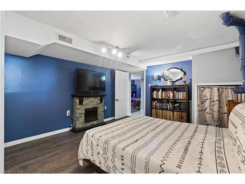 11366 Highway 3 West, Wainfleet, ON - Indoor Photo Showing Bedroom With Fireplace