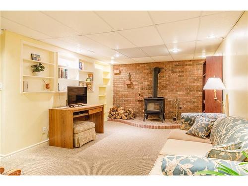 18 Alan Cr, Fonthill, ON - Indoor Photo Showing Basement With Fireplace