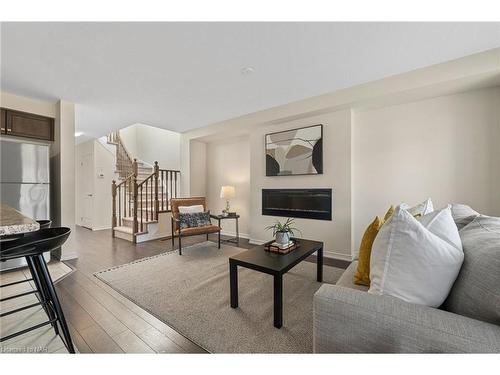 7739 Dockweed Drive, Niagara Falls, ON - Indoor Photo Showing Living Room With Fireplace