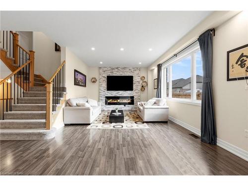 4500 Eclipse Way, Niagara Falls, ON - Indoor Photo Showing Living Room With Fireplace