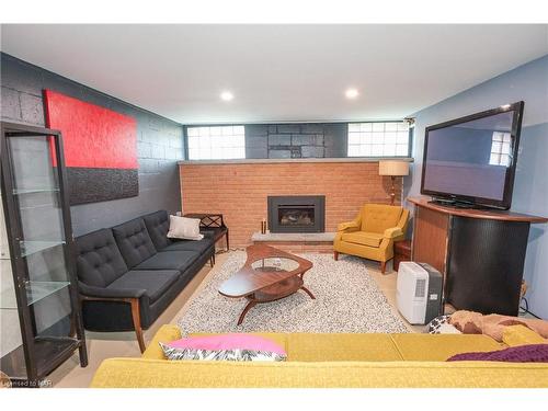 7001 Concord Crescent, Niagara Falls, ON - Indoor Photo Showing Basement With Fireplace