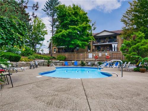 901-81 Scott Street, St. Catharines, ON - Outdoor With In Ground Pool With Deck Patio Veranda With Backyard