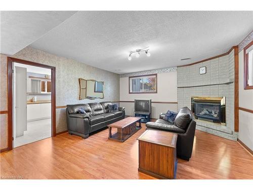 7737 Mount Carmel Boulevard, Niagara Falls, ON - Indoor Photo Showing Living Room With Fireplace