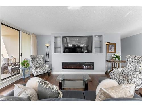 1008-3 Towering Heights Boulevard, St. Catharines, ON - Indoor Photo Showing Living Room With Fireplace