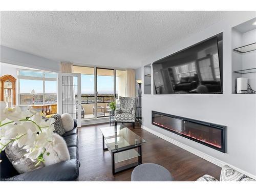 1008-3 Towering Heights Boulevard, St. Catharines, ON - Indoor Photo Showing Living Room With Fireplace