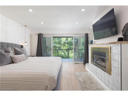 1647 Gregory Road, St. Catharines, ON - Indoor Photo Showing Bedroom With Fireplace