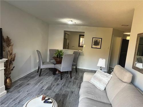 504-8111 Forest Glen Drive, Niagara Falls, ON - Indoor Photo Showing Living Room With Fireplace