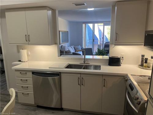 504-8111 Forest Glen Drive, Niagara Falls, ON - Indoor Photo Showing Kitchen With Double Sink