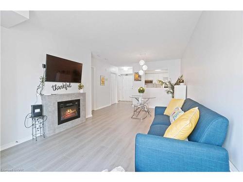 203-4090 John Charles Boulevard, Vineland, ON - Indoor Photo Showing Living Room With Fireplace