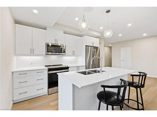 406-118 West Street, Port Colborne, ON - Indoor Photo Showing Kitchen With Double Sink With Upgraded Kitchen