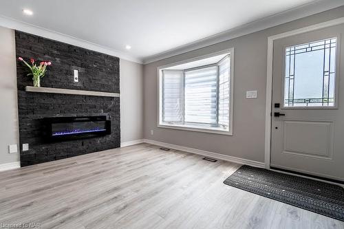 B-261 Scott Street, St. Catharines, ON - Indoor Photo Showing Other Room With Fireplace