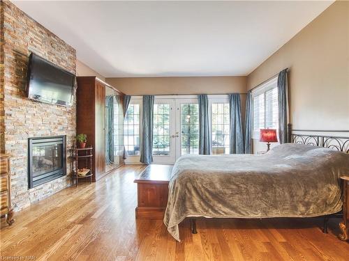 6039 Symmes Street, Niagara Falls, ON - Indoor Photo Showing Bedroom With Fireplace