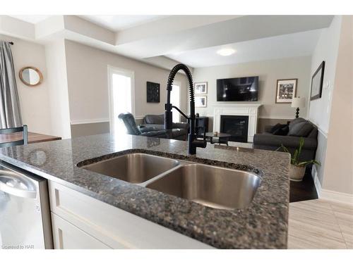 23 Willowbrook Drive, Welland, ON - Indoor Photo Showing Kitchen With Fireplace With Double Sink