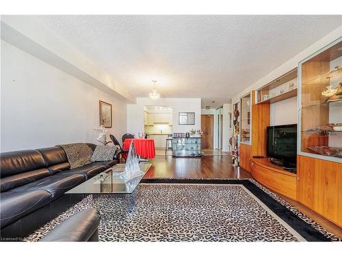 309-162 Martindale Road, St. Catharines, ON - Indoor Photo Showing Living Room With Fireplace