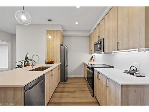 502-118 West Street, Port Colborne, ON - Indoor Photo Showing Kitchen With Double Sink With Upgraded Kitchen