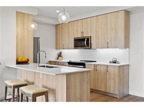 502-118 West Street, Port Colborne, ON - Indoor Photo Showing Kitchen With Double Sink