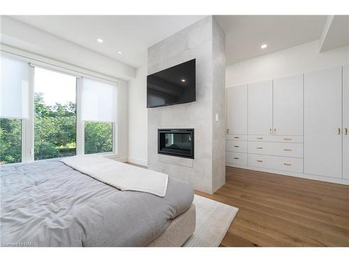 8-1397 York Road, Niagara-On-The-Lake, ON - Indoor Photo Showing Bedroom With Fireplace