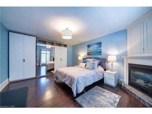 63 Rodman Street, St. Catharines, ON - Indoor Photo Showing Bedroom With Fireplace