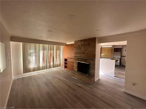 Upper-297 Scott Street, St. Catharines, ON - Indoor Photo Showing Living Room With Fireplace