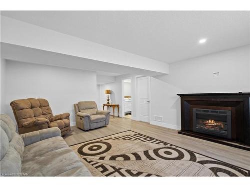 84 Thames Springs Crescent, Thamesford, ON - Indoor Photo Showing Living Room With Fireplace