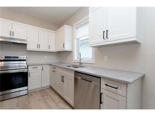 110 Sandcastle Key, Port Stanley, ON - Indoor Photo Showing Kitchen With Double Sink