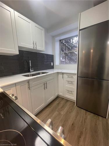 D-20 Craig Street, London, ON - Indoor Photo Showing Kitchen With Double Sink