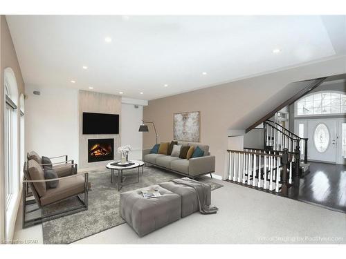 22 Mcintosh Court, London, ON - Indoor Photo Showing Living Room With Fireplace
