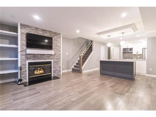 10-48 Ontario Street S, Grand Bend, ON - Indoor Photo Showing Living Room With Fireplace