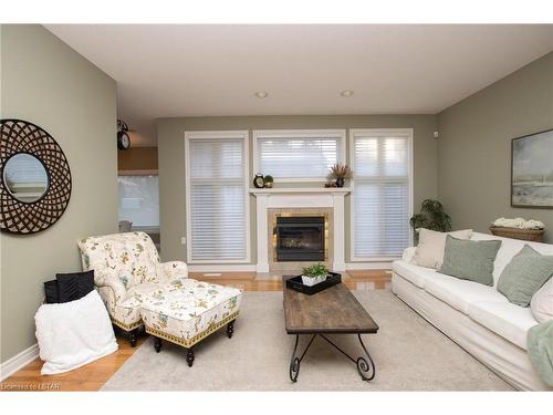 21 Calvert Lane, Ilderton, ON - Indoor Photo Showing Living Room With Fireplace