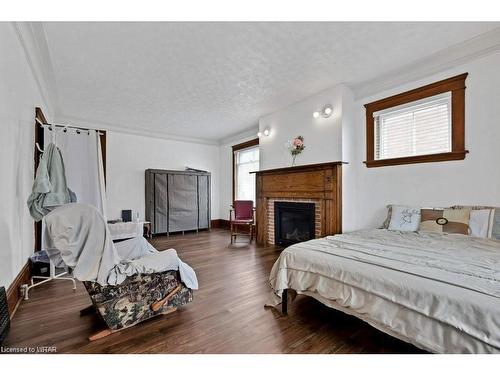 3 Daly Avenue, Stratford, ON - Indoor Photo Showing Bedroom With Fireplace